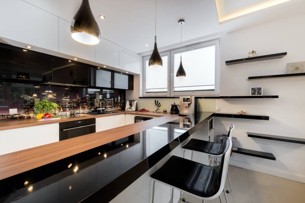 Modern open space luxury kitchen in black and white design