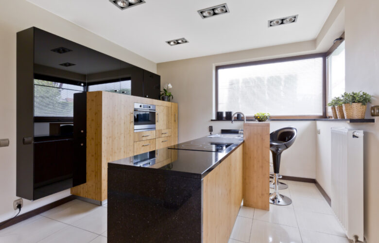 Spacious villa kitchen with window and modern furniture